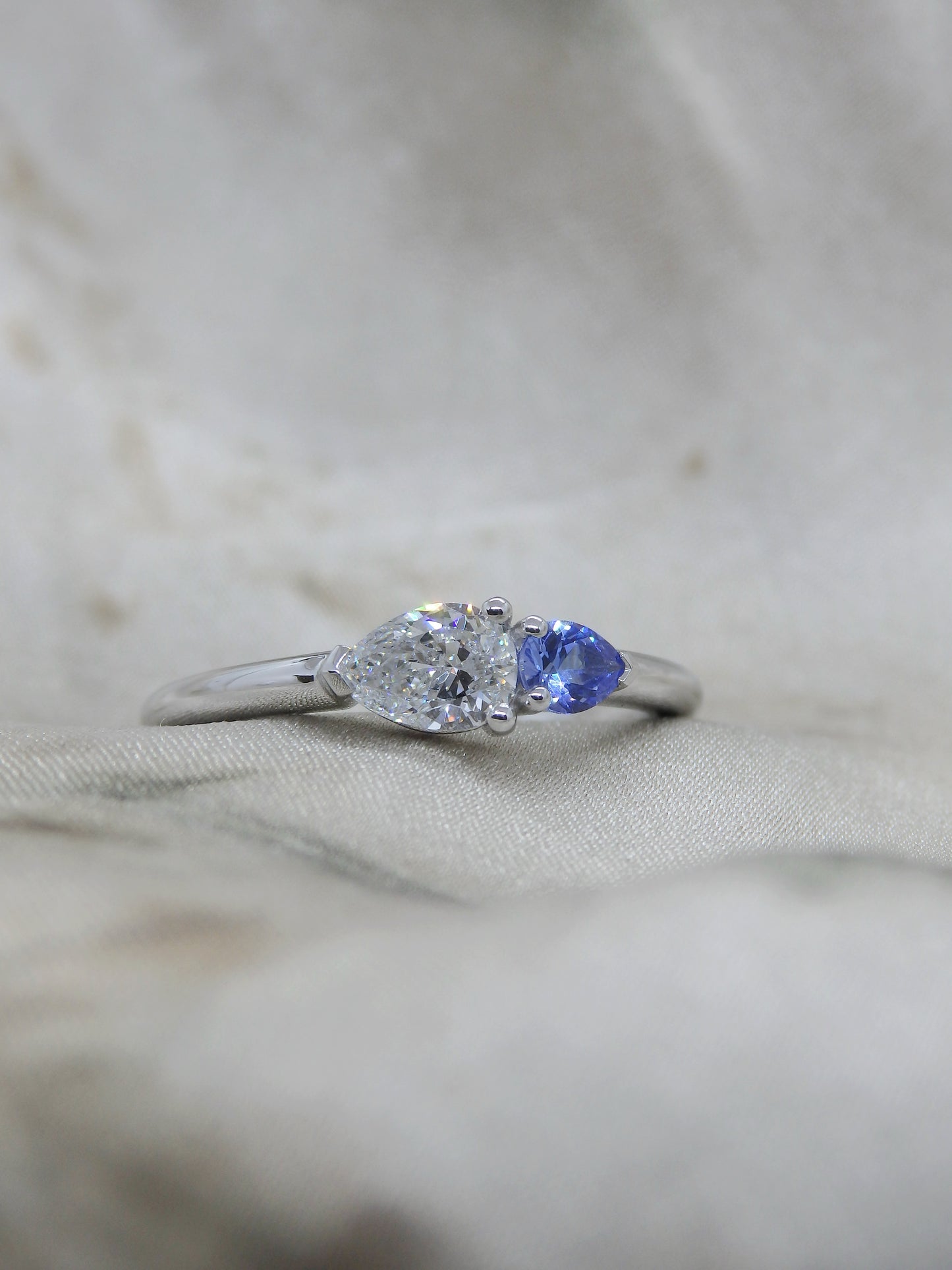 Platinum Pear “Duet”, 0.40ct EVS1 Diamond & Ceylon Sapphire Engagement Ring