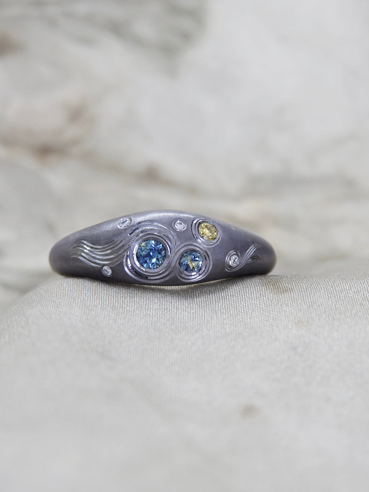 Hand Engraved black Tantalum Ring with australian parti sapphires and natural diamonds in a high domed tapering profile