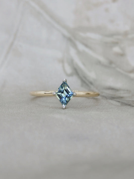 gold ring with blue parti sapphire