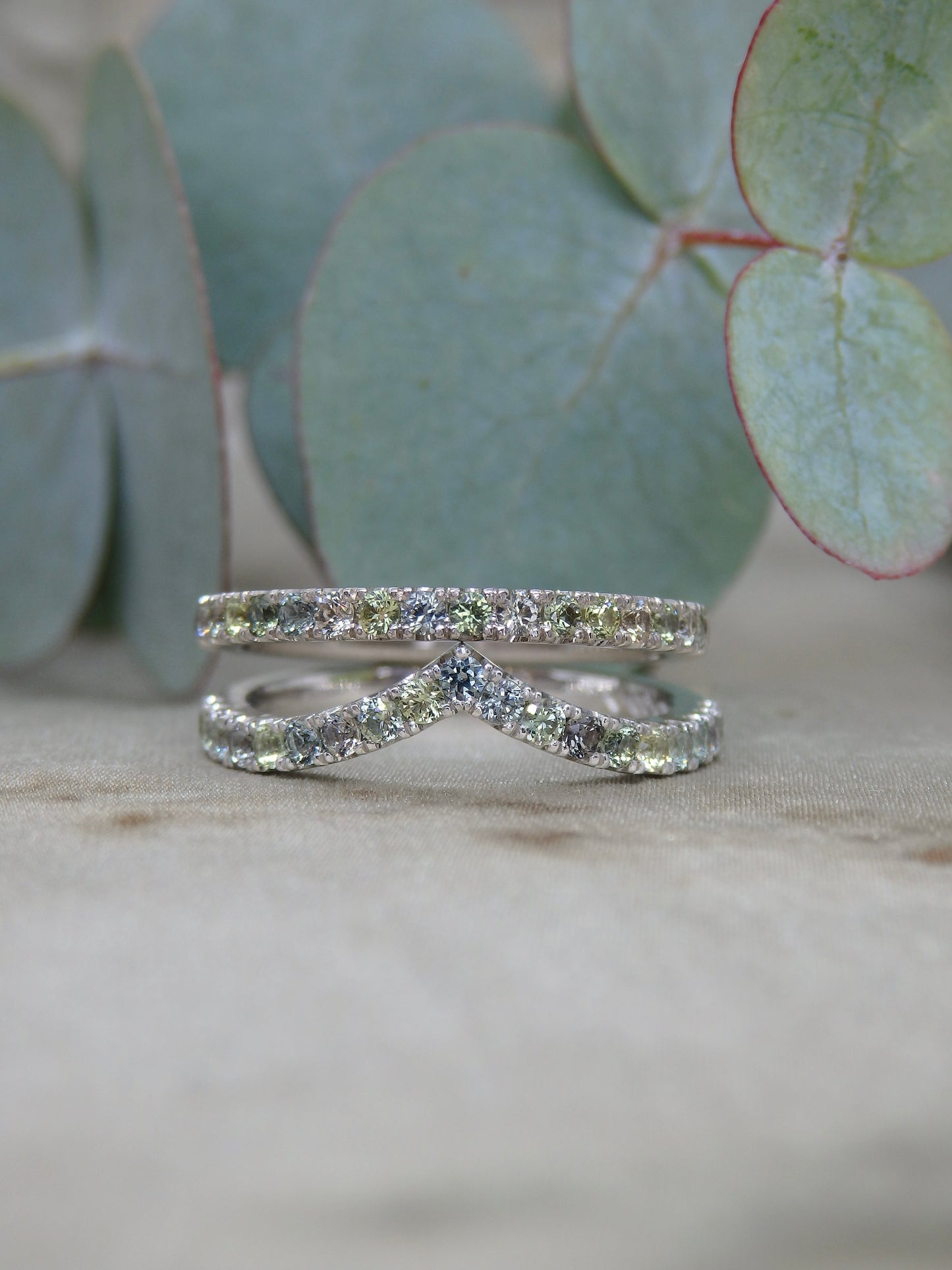 Multi tone pastel green, blue, yellow, purple and white diamond-cut sparkly sapphires micro-pave set in 18ct white gold and platinum fitted wedding band or eternity rings