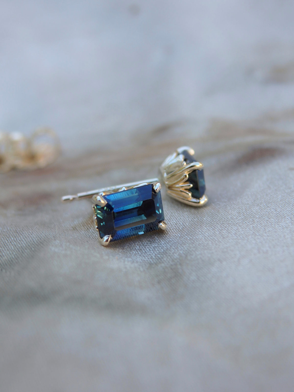 1.44ct Emerald Cut Blue Australian Sapphire Gold Studs - Fleur de lis motif